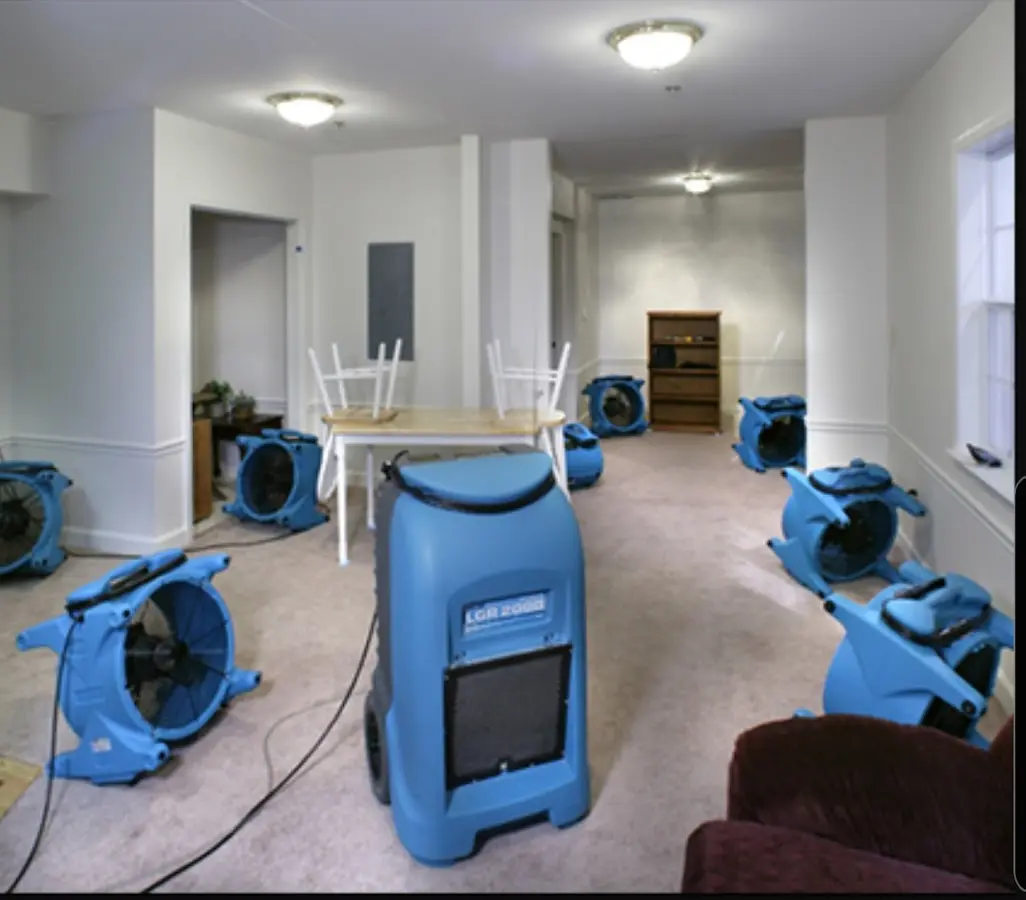 Air movers and dehumidifier setup for Water Damage Restoration in Northwood
